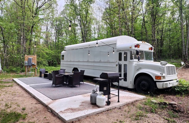 Rustic Converted School Bus with Outdoor Shower Near ORV Trails in Manistee National Forest, Michigan