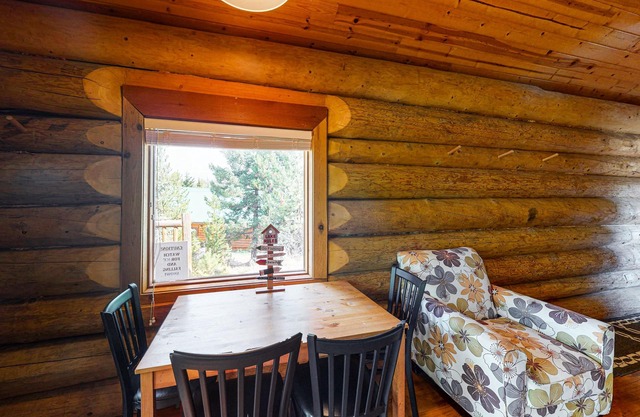 Rustic lakefront resort log cabin with deck, internet, and full kitchen