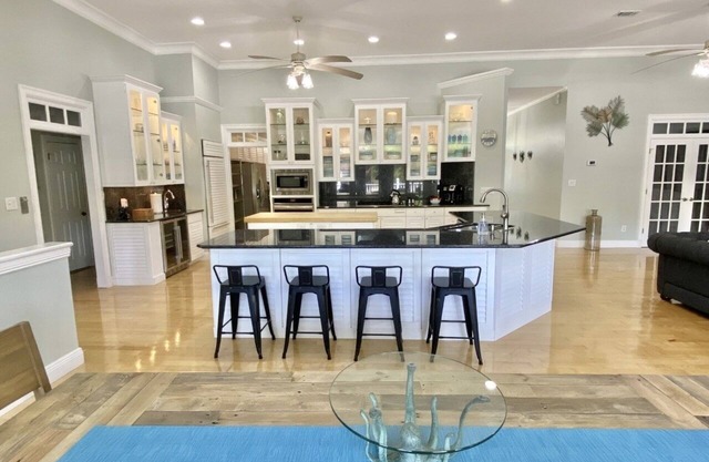 Salty Pelican Retreat on Canal with Heated Pool, Elevator and Boat Dock