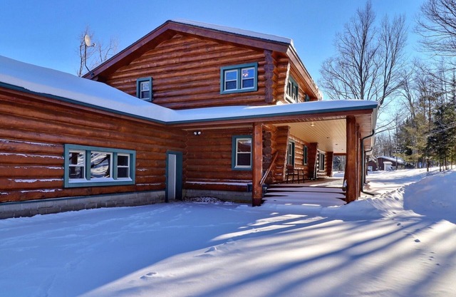 Scandinavian hand-scribed full log home on 31 acres and a quiet lake and trails