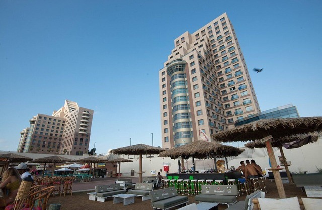 sea sun and fun on the mediterranean beach , restaurants and bars near by
