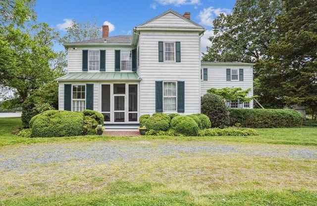 Secluded 1870s farmhouse full of historic charm + breathtaking waterfront views!