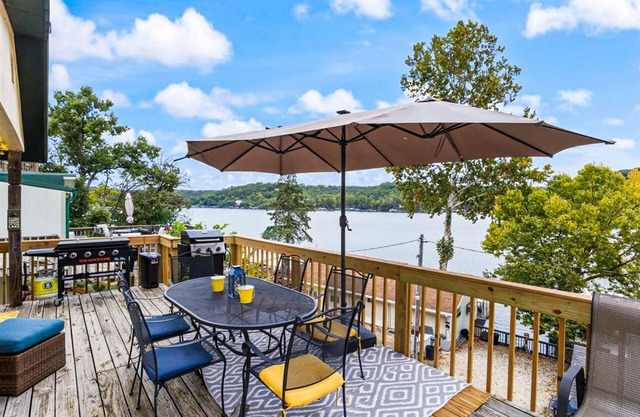 Secluded lakefront home with dock, fire table, lake views, & streaming