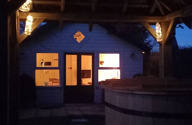 Secluded timber cabin with private garden and wood fired hot tub.