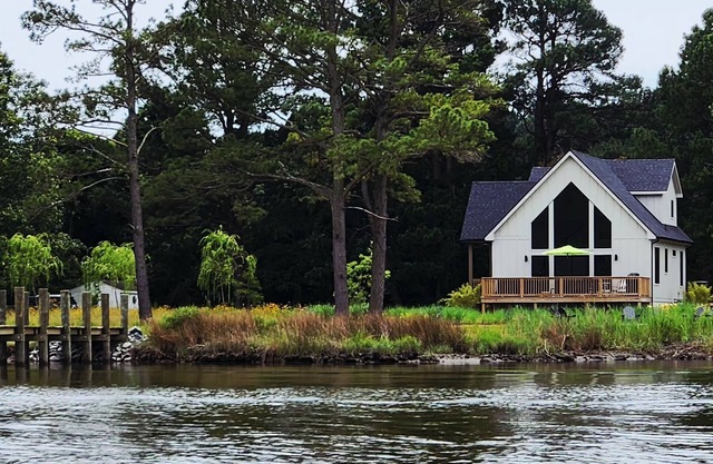 Secluded waterfront getaway with hot tub,fire pit, and private dock.