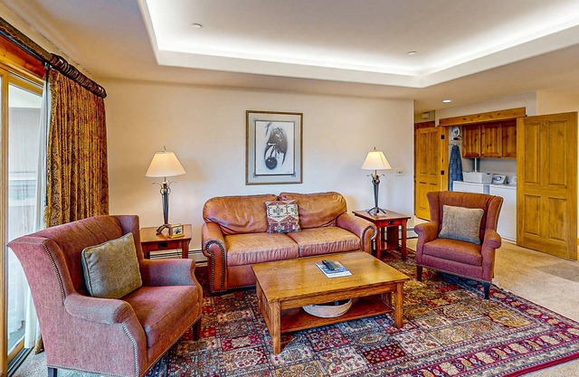 Second floor condo with gas fireplace, WiFi, pool, and hot tub - walk to gondola
