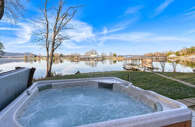 Serene lakefront home with dock, hot tub, pool table & beautiful views