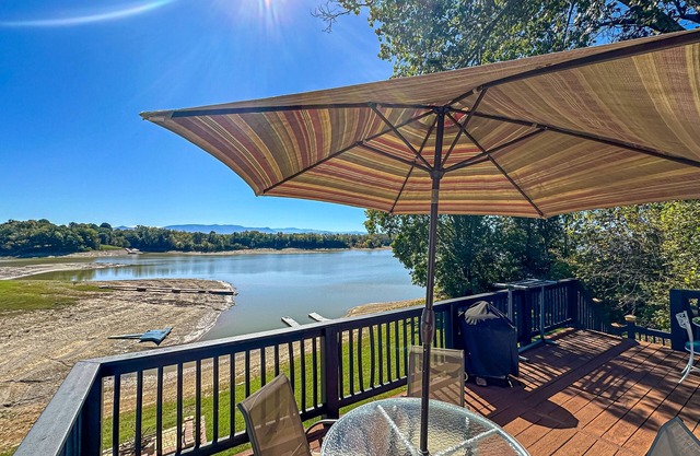Serene lakefront home w/ free attraction tickets, dock, game room, & fire pit