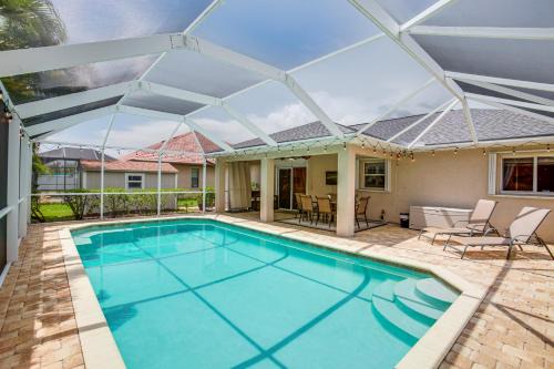 Shop, Dine and Unwind Poolside Cape Coral Retreat!