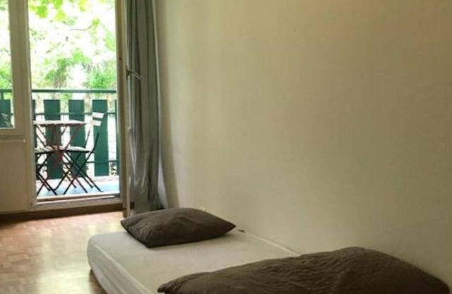 single bed in a 20 m2 room shared by 2