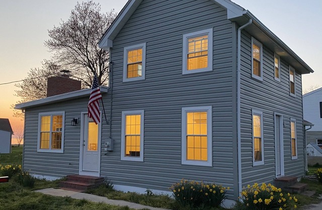 Single family home with screened porch.