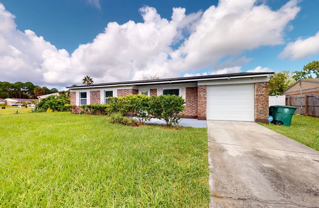 Single-level vacation home with fenced yard, W/D, & central AC - dog-friendly