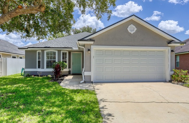 Single-story home with lagoon view, garden patio & easy drive to the beach