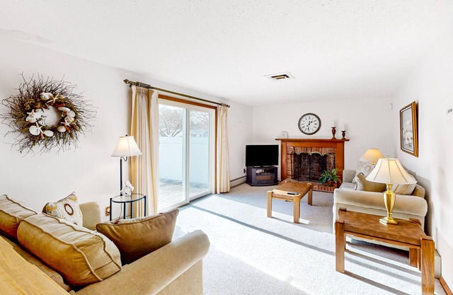 Single-story home with fenced yard, deck & great location near town/beaches