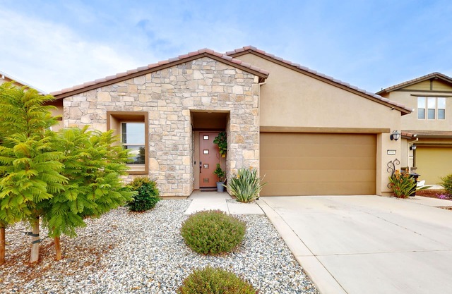 Single-story home with private patio, grill, AC, W/D, & central location