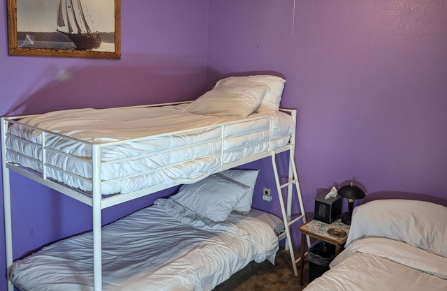 Single twin bed in Shared room, water view/access, Mini Fridge, pets, Fire pit.