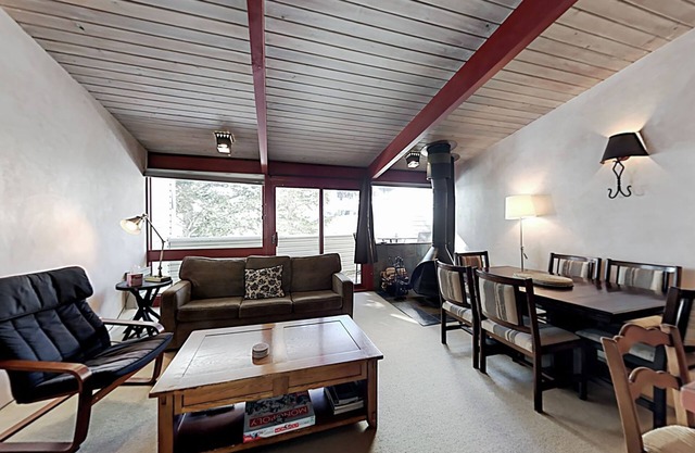 Ski-in/out delight with woodstove & balcony- walk to shops, dining & skating