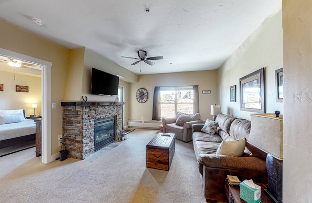 Ski-in/ski-out condo with gas fireplace, shared hot tub, pool, & mountain views