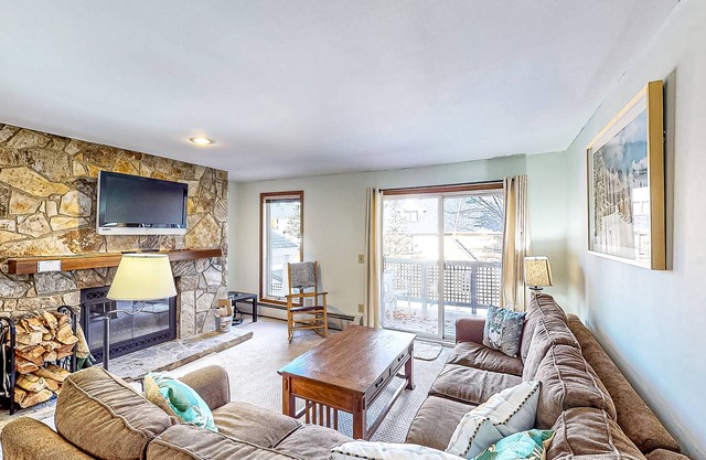 Ski-in/ski-out condo with deck, wood-burning fireplace, & community amenities