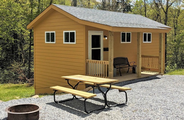 Sleeps up to 4, kitchenette, full bathroom, fire ring/picnic table, air conditioned/heated.