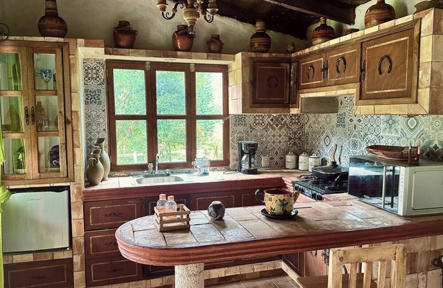 Slim's cabin with stream on the banks of Orizaba
