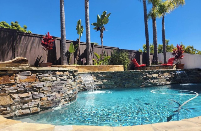 Soak in the sun with an outdoor entertainment area/pool/spa in relaxing Carlsbad