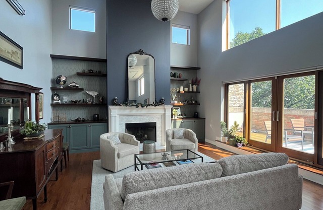 Soaring ceilings, city views and private rooftop deck!