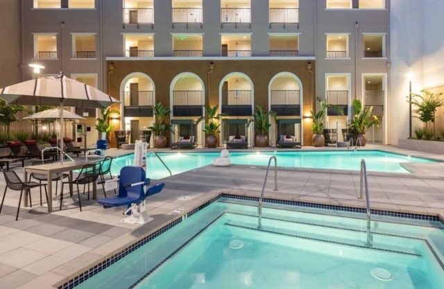 Spacious 1BR Condo with Serene Pool and Lush Gardens