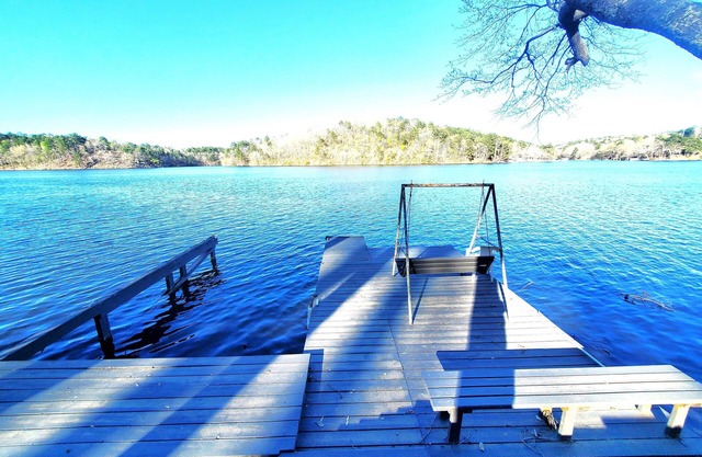 Spacious 4-bed, 3-bath home located on Lake Catherine with pool and boat dock