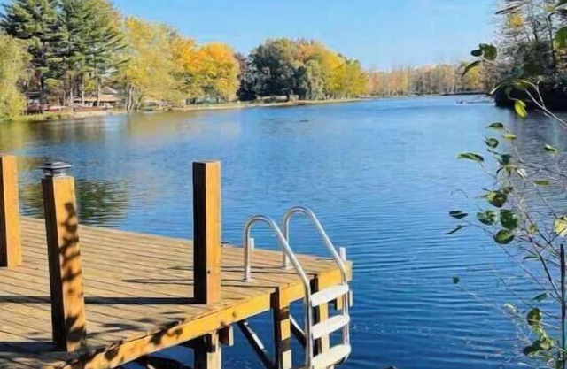 Spacious 4-bedroom waterfront house in Sylvan Beach with private yard and dock.