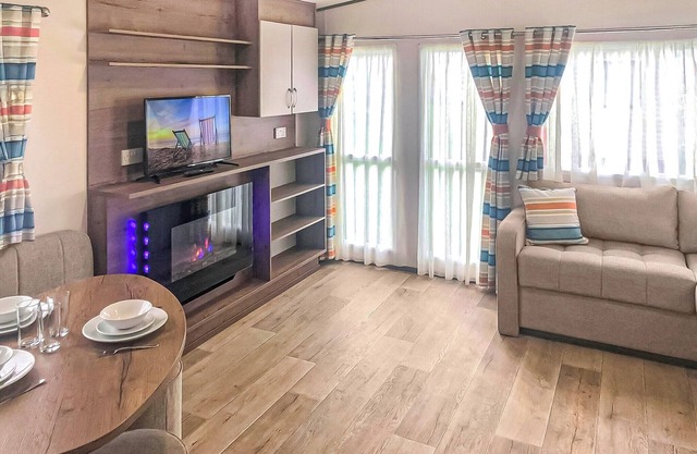 Spacious and comfortable 12ft-wide caravan with one double and two twin.