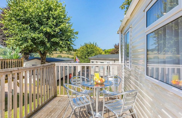Spacious and luxurious 12ft-wide caravan with one double and one twin bedroom.