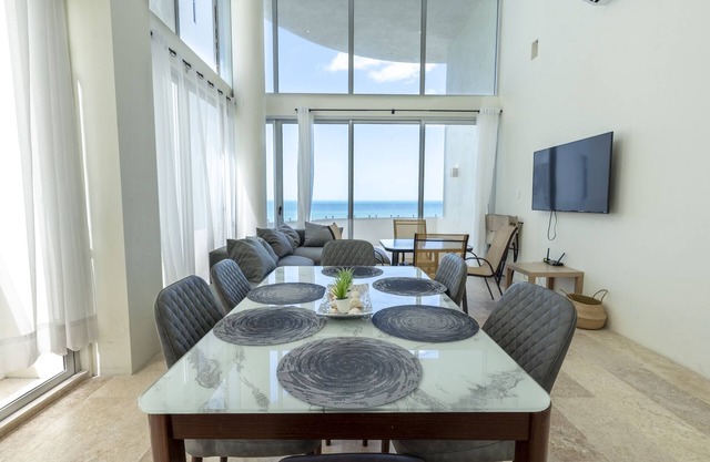 Spacious beachfront apartment with ocean views, private balcony & heated pool