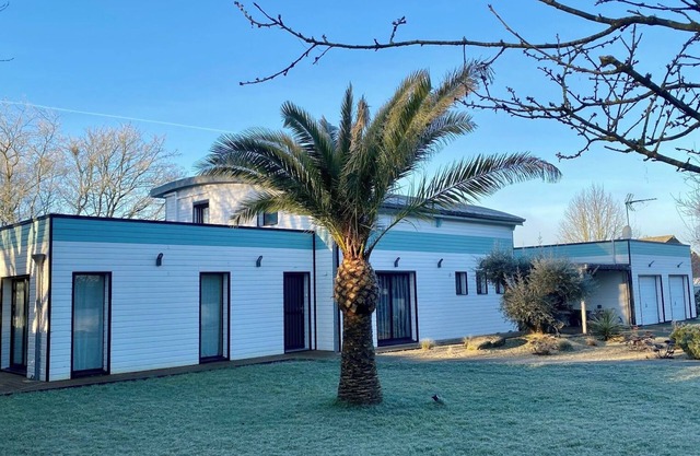 Spacious contemporary wooden house with swimming pool near the Brocéliande forest