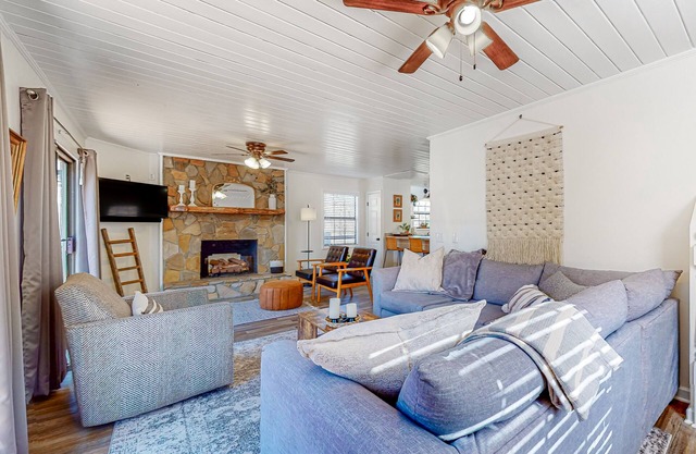 Spacious creekside home with deck, firepit, grill, water views, & washer/dryer