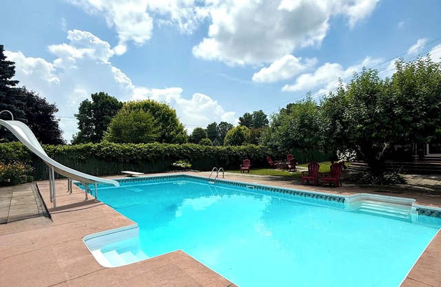 Spacious Farmhouse Retreat - pet friendly, pool, deck, Orchard views, and more.