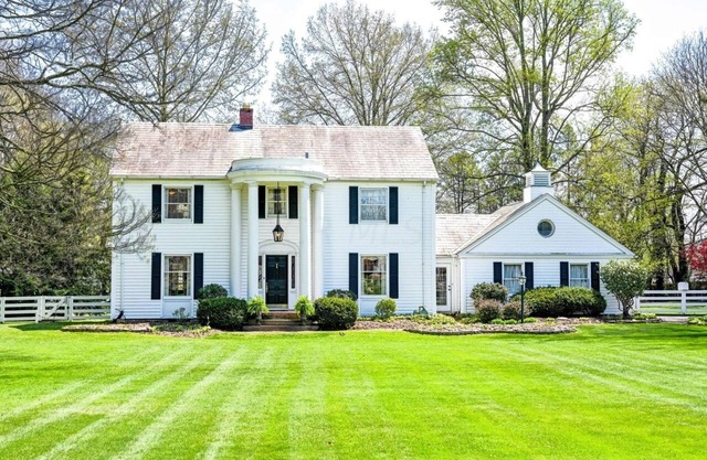 Spacious historic Colonial Manor with sprawling manicured lawns & mature trees.