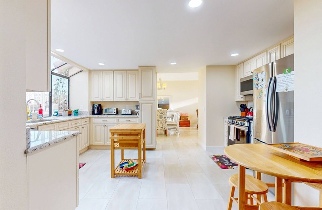 Spacious home in a great location with firepit, grill, games, AC, & smart TVs