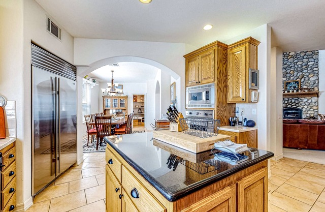 Spacious home on 3.5 acres with covered patio, gourmet kitchen, & patio