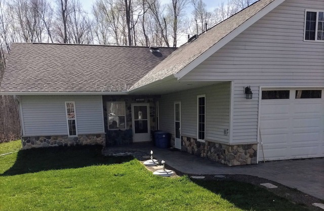 Spacious home with EV charging station two miles from Big Bay Town Park.