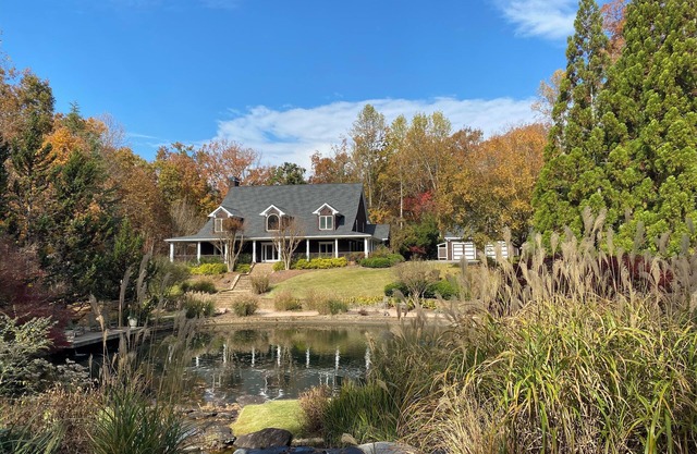 Spacious Lake Front Home with beautiful Gardens, Pond, Waterfall, Pool, & Dock