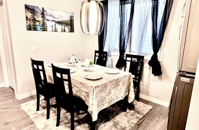 Spacious main floor suite in detached bungalow w/ Garage & Kitchen