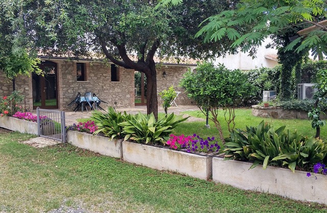 Spacious one-bedroom apartment with large bedroom, porch over entrance and pool
