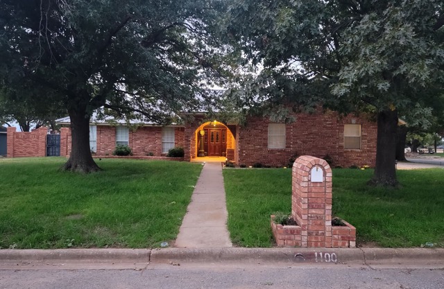 Spacious small town retreat with inground pool and privacy fence.
