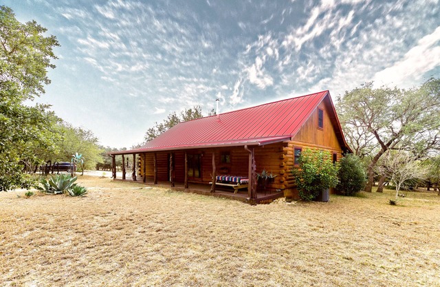 Spectacular Log Cabin on 10 Acres in Dripping Springs