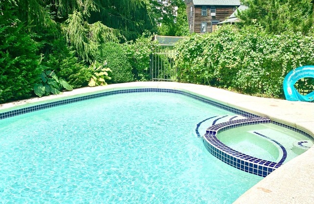 Stroll to beach at charming, historical, rustic home w/expansive yard & pool.