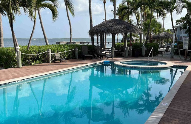Stunning beachfront condo next to restaurant & a short drive to famous RumPoint