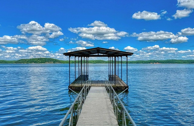 Stunning lakefront home with private dock, screened in porch and firepit