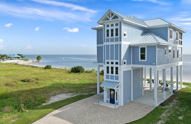 Stunning new beach house right on the sand, with use of private boat dock.