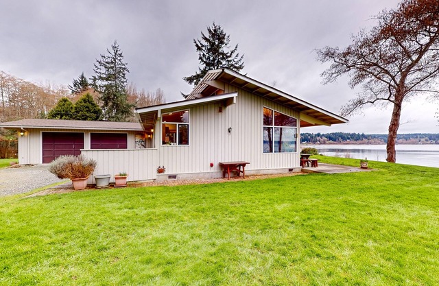 Stunning waterfront escape with patio, beach access, & gorgeous bay views